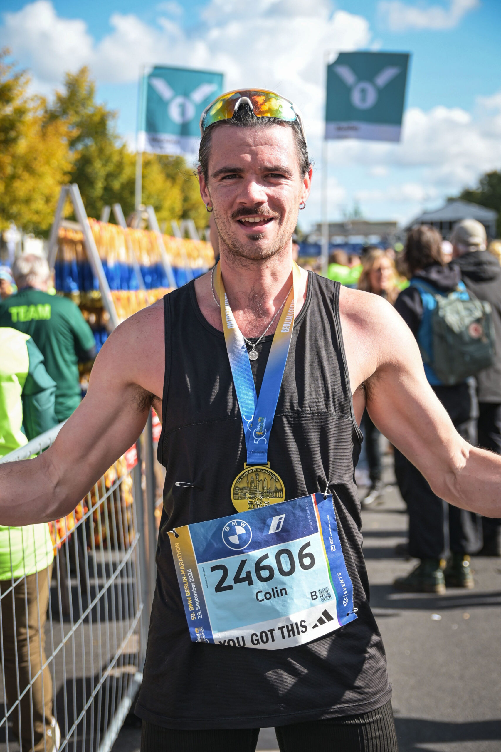Colly finishing a marathon with a medal